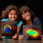 Great-granddaughters of Henrietta Lacks with pictures of HeLa cells