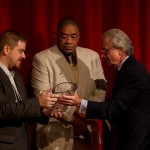 Dr. Robert Blum of the Urban Health Institute presenting their award