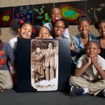 Lacks family with photo of Henrietta and David Lacks