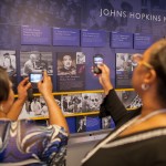 Lacks family viewing Henrietta Lacks tile in Johns Hopkins Hospital