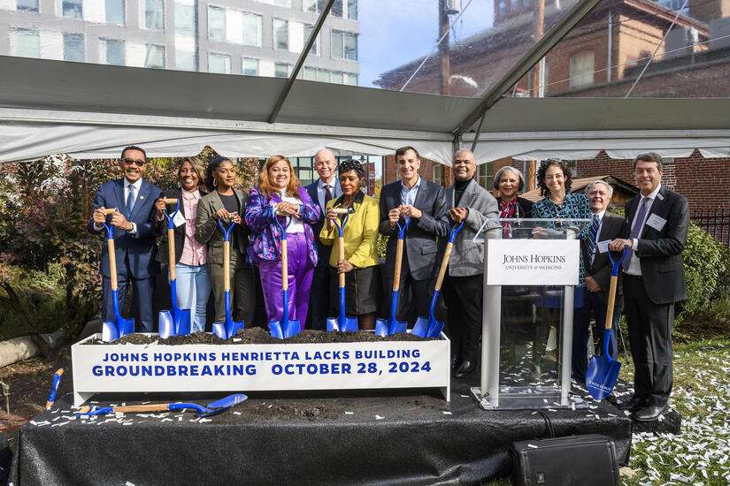 Image caption: From left to right: U.S. Rep. Kweisi Mfume, Jeri Lacks Whye, JaBrea Rodgers, Veronica Robinson, School of Medicine Dean Theodore DeWeese, Maryland House Speaker Adrienne Jones, JHU President Ron Daniels, Victor Vines, Lisa Cooper, Lainie Rutkow, Dan Ford and Jeffrey Kahn. Image credit: Will Kirk / Johns Hopkins University